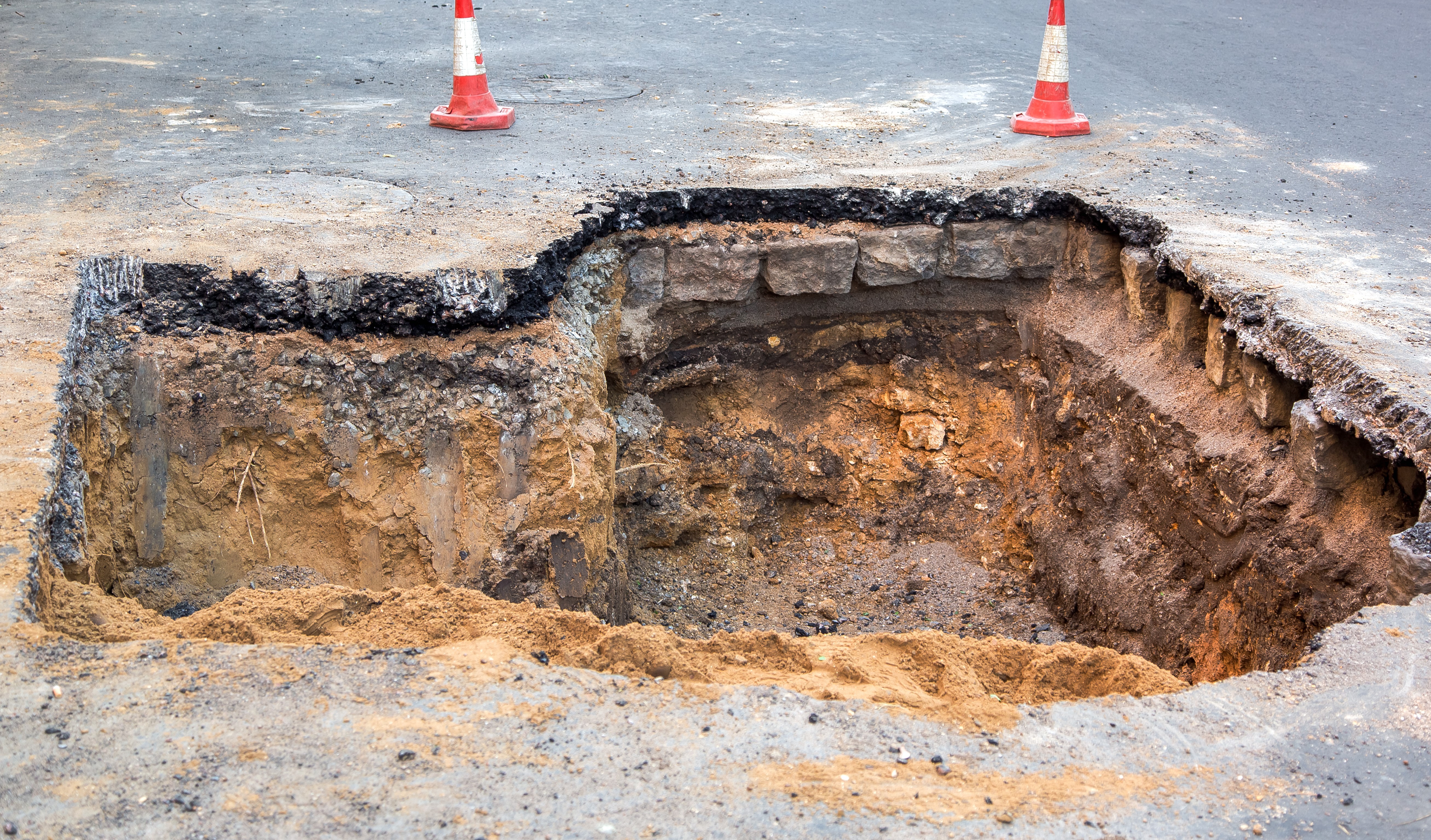 sinkhole in asphalt