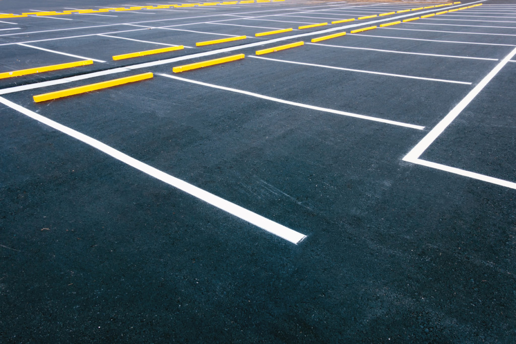 large parking lot with newly painted white lines