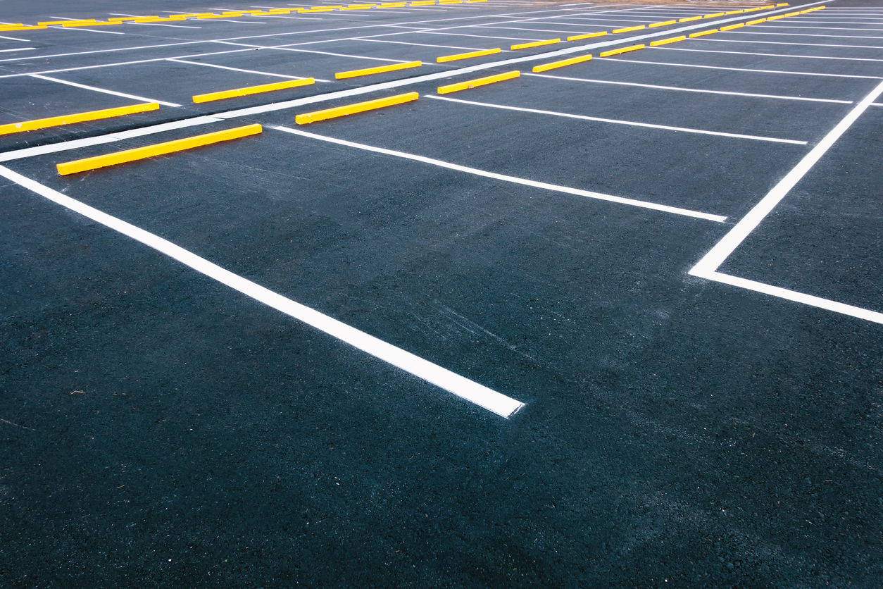 empty parking lot with newly painted white lines