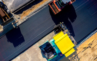 Aerial view on the new asphalt road under construction