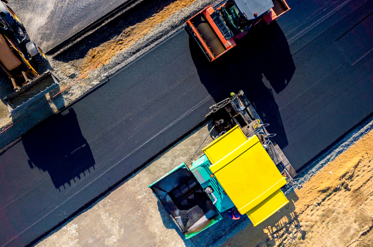 Aerial view on the new asphalt road under construction