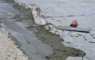 Wet concrete with hand trowels