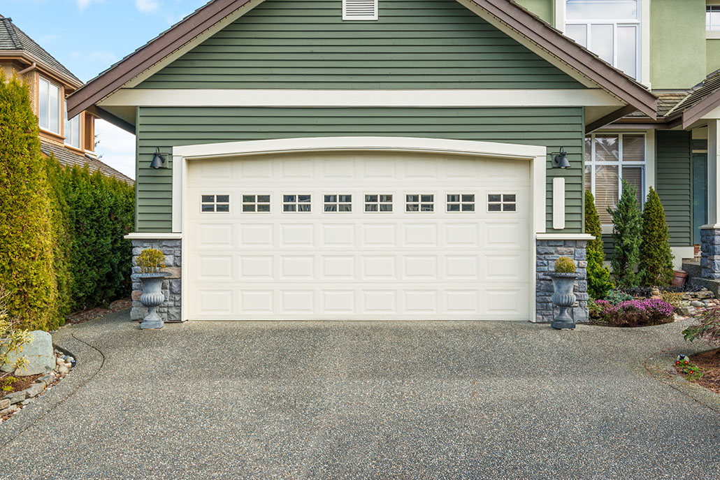 Luxury house with a two-car garage on a sunny day in Vancouver, Canada
