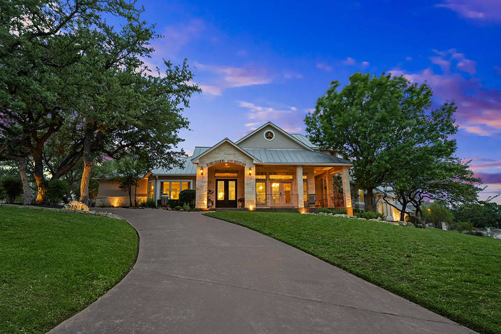 home with a new asphalt driveway